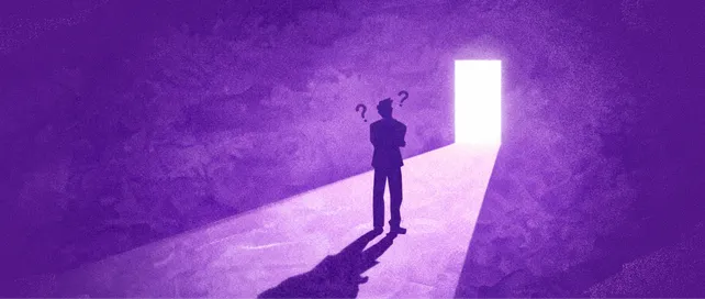 Serene sunrise over a rolling landscape with a winding river in the middle.